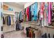 Spacious walk-in closet with clothing racks and shelves at 1357 Prevenient Dr, Wake Forest, NC 27587