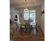 Dining room with natural light, chandelier, and glass table with seating for six at 1357 Prevenient Dr, Wake Forest, NC 27587