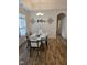 Elegant dining room featuring stylish decor, a modern table set, and wood-look floors, perfect for gatherings at 1357 Prevenient Dr, Wake Forest, NC 27587