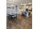 Open-concept dining room with stylish decor, sleek table set, and wood-look floors, perfect for gatherings at 1357 Prevenient Dr, Wake Forest, NC 27587
