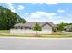 Exterior view of home with a well-manicured lawn and white fence at 1357 Prevenient Dr, Wake Forest, NC 27587