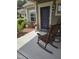 Inviting front porch with comfortable rocking chairs, potted plants, and stylish details at 1357 Prevenient Dr, Wake Forest, NC 27587