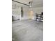 Spacious two-car garage with a water heater and extra storage racks at 1357 Prevenient Dr, Wake Forest, NC 27587