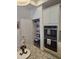 Kitchen includes double oven, granite countertops, white cabinets and a well-stocked pantry at 1357 Prevenient Dr, Wake Forest, NC 27587