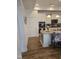 Bright kitchen features stainless steel appliances, granite countertops, and hardwood flooring at 1357 Prevenient Dr, Wake Forest, NC 27587