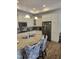 Spacious kitchen boasts granite counters, island seating, and stainless steel appliances at 1357 Prevenient Dr, Wake Forest, NC 27587