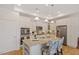 Modern kitchen featuring white cabinets, stainless steel appliances, granite countertops, and center island at 1357 Prevenient Dr, Wake Forest, NC 27587