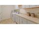 Laundry room featuring washer, dryer, sink and cabinetry at 1357 Prevenient Dr, Wake Forest, NC 27587