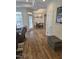 Open-concept living room with hardwood floors leading to a dining area and ample natural light at 1357 Prevenient Dr, Wake Forest, NC 27587
