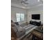 Cozy living room with a ceiling fan, recessed lights, comfortable seating and large window to let in natural light at 1357 Prevenient Dr, Wake Forest, NC 27587