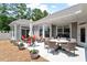 Outdoor patio with comfortable seating, perfect for entertaining and relaxing in a serene setting at 1357 Prevenient Dr, Wake Forest, NC 27587
