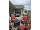 Inviting patio with outdoor seating, including a table and chairs, a fire pit, and an umbrella for shade at 1357 Prevenient Dr, Wake Forest, NC 27587