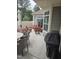 Relaxing patio featuring a grill, table, chairs, and umbrella, perfect for outdoor entertaining and dining at 1357 Prevenient Dr, Wake Forest, NC 27587