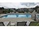Relaxing community pool with plenty of chairs and a serene atmosphere at 1357 Prevenient Dr, Wake Forest, NC 27587