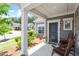 Inviting front porch with comfortable seating and tasteful landscaping, offering a relaxing outdoor space at 1357 Prevenient Dr, Wake Forest, NC 27587