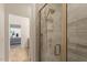 Tiled walk-in shower with frameless glass door at 1357 Prevenient Dr, Wake Forest, NC 27587