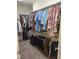 Walk-in closet with rows of clothes and accessories at 1357 Prevenient Dr, Wake Forest, NC 27587