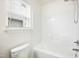 Clean bathroom with a white bathtub and shower at 1506 Golden Bell Dr, Raleigh, NC 27610