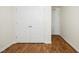 Bedroom view with closet doors and hardwood flooring at 1506 Golden Bell Dr, Raleigh, NC 27610