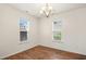 Empty dining room features vinyl wood-look floors and lots of natural light at 1506 Golden Bell Dr, Raleigh, NC 27610