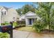 Charming single Gathering home with manicured lawn and sidewalk leading to a covered front porch at 1506 Golden Bell Dr, Raleigh, NC 27610