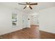 Bright, empty living room with hardwood flooring and a view into the dining area at 1506 Golden Bell Dr, Raleigh, NC 27610