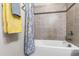 Bathroom featuring bathtub with shower and decorative curtain at 1577 Tice Hurst Ln, Apex, NC 27502