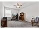 Bedroom featuring ceiling fan, window, and study furniture at 1577 Tice Hurst Ln, Apex, NC 27502