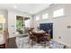 Cozy dining area with access to outdoor deck and beautiful natural light at 1577 Tice Hurst Ln, Apex, NC 27502