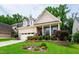 Beautifully landscaped front yard of this charming two-story home at 1577 Tice Hurst Ln, Apex, NC 27502