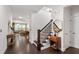 Open hallway showcasing hardwood floors and seamless transition to living spaces at 1577 Tice Hurst Ln, Apex, NC 27502