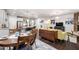 Open-concept living area with hardwood floors, fireplace, and adjacent kitchen at 1577 Tice Hurst Ln, Apex, NC 27502