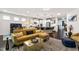Bright and open living room with a kitchen island and comfortable seating area at 1577 Tice Hurst Ln, Apex, NC 27502