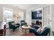 Stylish sitting room featuring ample seating and beautiful french doors at 1577 Tice Hurst Ln, Apex, NC 27502