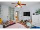 Inviting bedroom decorated with ivy on the wall, complemented by plush rugs and ample natural light at 1633 Lakestone Village Ln, Fuquay Varina, NC 27526