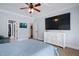 Spacious bedroom with tray ceiling, a ceiling fan, and TV on a white dresser at 1633 Lakestone Village Ln, Fuquay Varina, NC 27526