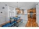 Cozy breakfast nook with wood floors, white trim, and a view of the kitchen at 1633 Lakestone Village Ln, Fuquay Varina, NC 27526