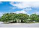 Beautiful community area with a gazebo surrounded by lush trees and landscaping at 1633 Lakestone Village Ln, Fuquay Varina, NC 27526