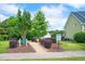 Picturesque community park featuring lush landscaping, walking paths, and serene seating areas by Lake Helen at 1633 Lakestone Village Ln, Fuquay Varina, NC 27526
