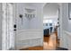 Entryway with a bench and hooks, leading to a cozy living room space at 1633 Lakestone Village Ln, Fuquay Varina, NC 27526