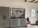 Garage featuring a workbench with tools and storage cabinet, creating an organized space at 1633 Lakestone Village Ln, Fuquay Varina, NC 27526