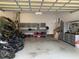 Spacious garage with ample storage, including cabinets, and room for kayaks and bikes at 1633 Lakestone Village Ln, Fuquay Varina, NC 27526