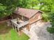 A lovely brick home with a spacious deck and two-car garage, nestled in a serene, tree-lined neighborhood at 1822 Routh Rd, Burlington, NC 27217