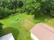 Aerial view of expansive green backyard, ideal for outdoor activities and relaxation, with the home to the right at 1822 Routh Rd, Burlington, NC 27217
