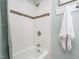 Bathtub with subway tile, shower curtain and hardware, and small vanity unit at 1822 Routh Rd, Burlington, NC 27217
