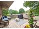 Outdoor deck with seating, a grill, and views of the surrounding landscape at 1822 Routh Rd, Burlington, NC 27217