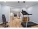 Exercise room with view to cozy sitting room with fireplace at 1822 Routh Rd, Burlington, NC 27217