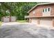 Exterior of house with multiple garages and extended driveway at 1822 Routh Rd, Burlington, NC 27217