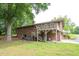 Exterior boasts a spacious deck, lush greenery, and well-manicured landscaping at 1822 Routh Rd, Burlington, NC 27217