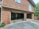 A two-car garage features a spacious interior, exposed ceiling, and concrete floor, perfect for storage and hobbies at 1822 Routh Rd, Burlington, NC 27217